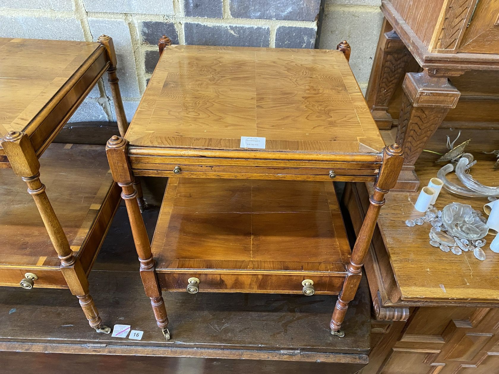 A pair of reproduction yew two tier side tables fitted slides, width 46cm, depth 46cm, height 58cm